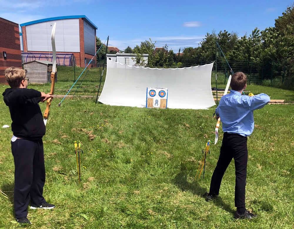 Two pupils on an archery day