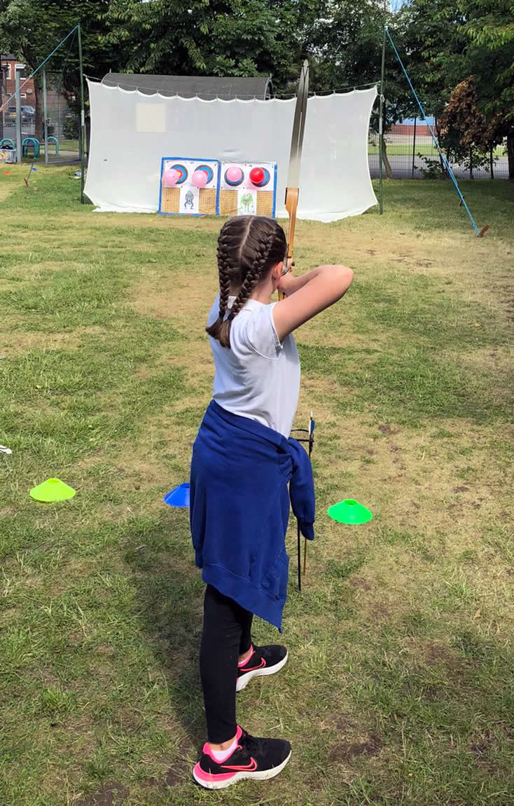 Young girl at an archery day